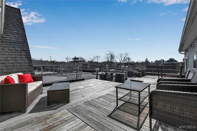 deck featuring outdoor lounge area