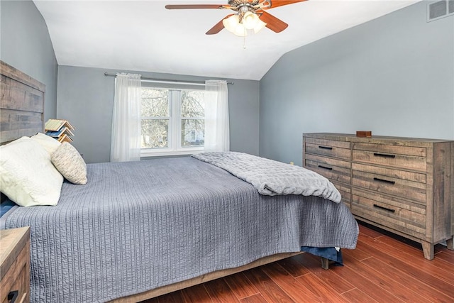 bedroom with visible vents, wood finished floors, a ceiling fan, and vaulted ceiling