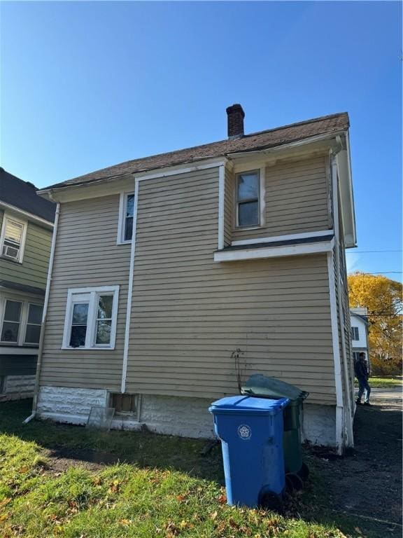 view of home's exterior with a chimney