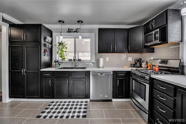 kitchen featuring light tile patterned floors, backsplash, stainless steel appliances, and a sink