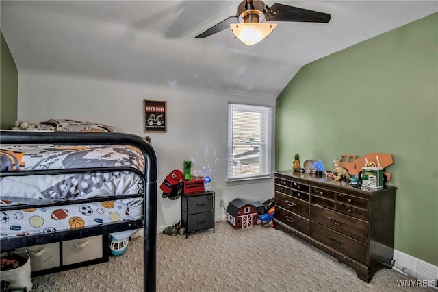 bedroom with carpet flooring, ceiling fan, baseboards, and lofted ceiling