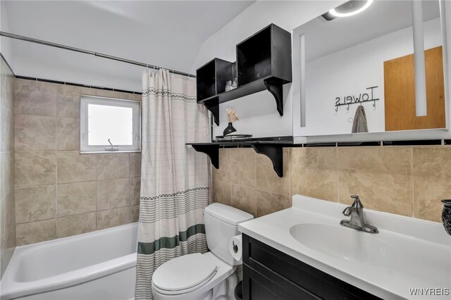 full bath featuring vanity, shower / bathtub combination with curtain, tile walls, toilet, and backsplash