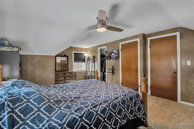 bedroom with a ceiling fan, carpet flooring, and vaulted ceiling