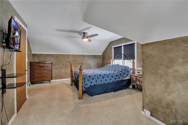 carpeted bedroom with ceiling fan and lofted ceiling