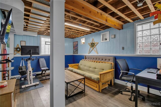 interior space featuring baseboards and wood finished floors