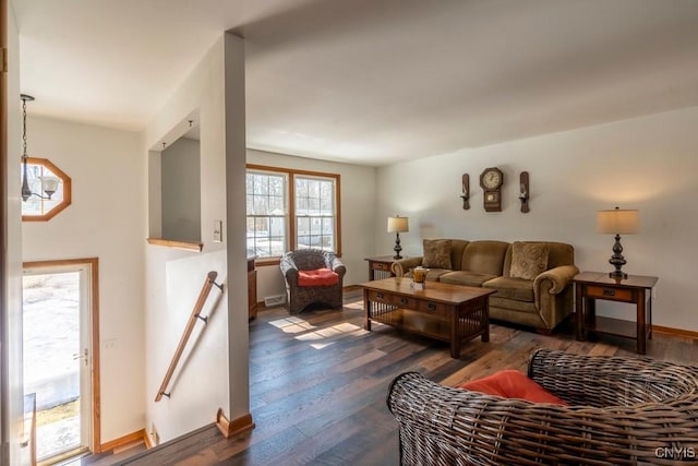 living room with dark wood-style floors and baseboards