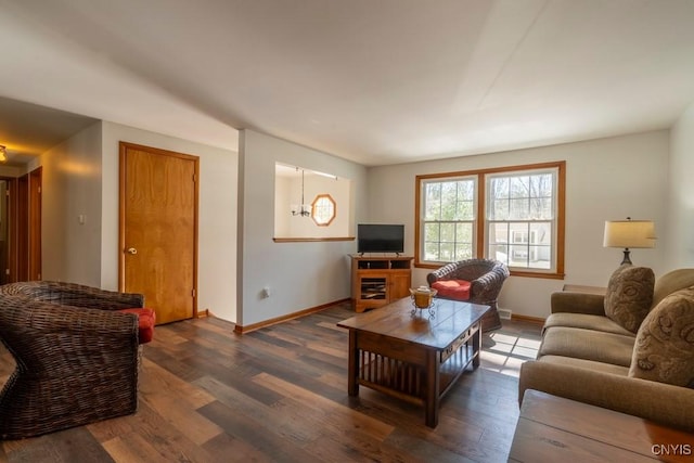 living room featuring baseboards and wood finished floors