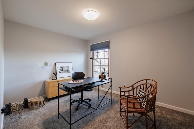 carpeted office featuring baseboards