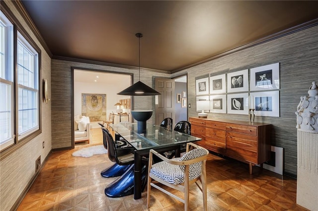 dining area featuring baseboards and ornamental molding