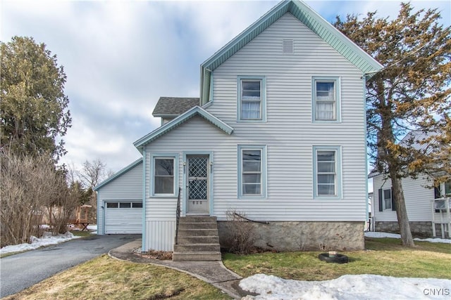 traditional home featuring a front yard and entry steps