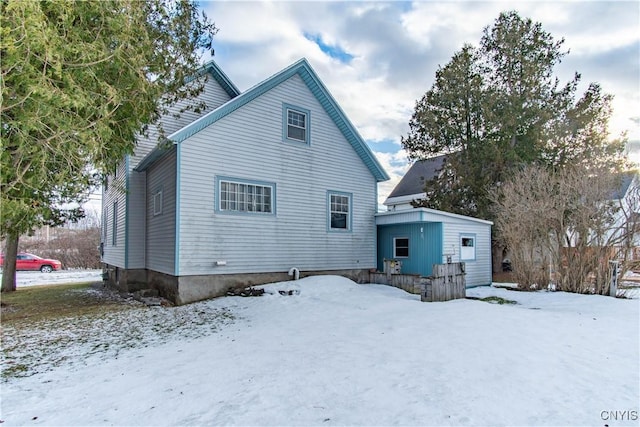 view of snow covered house