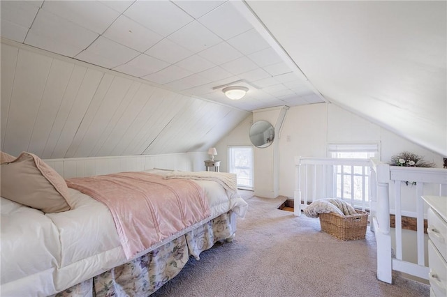 carpeted bedroom with vaulted ceiling