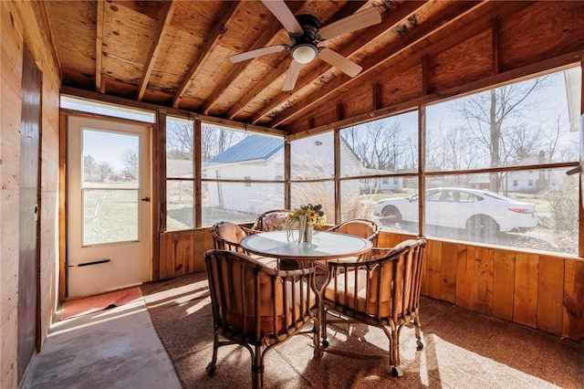 sunroom featuring ceiling fan and vaulted ceiling