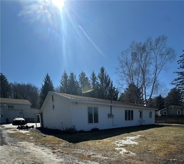 view of home's exterior featuring fence