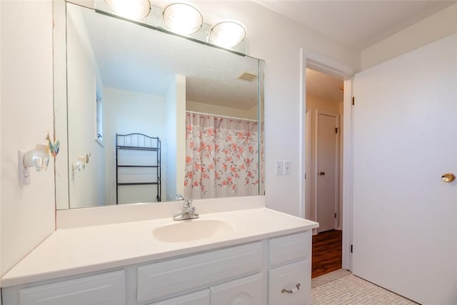 bathroom with visible vents and vanity