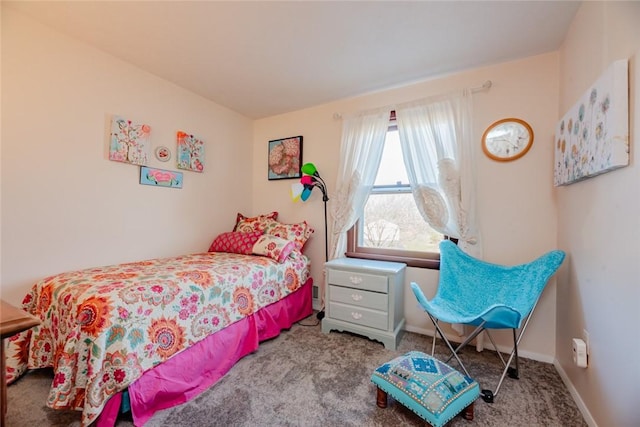 bedroom with baseboards and carpet