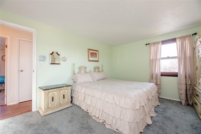 carpeted bedroom with baseboards