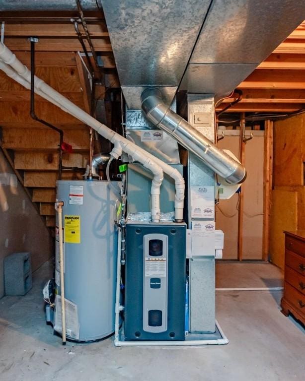 utility room with gas water heater