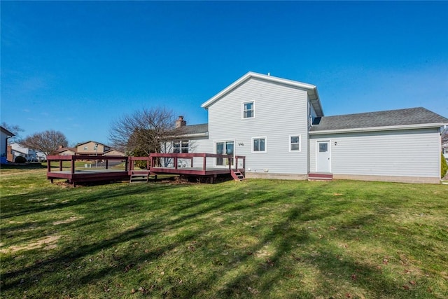 back of property with a lawn and a wooden deck