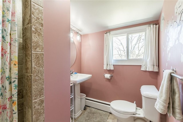 bathroom with a shower with shower curtain, baseboard heating, and toilet