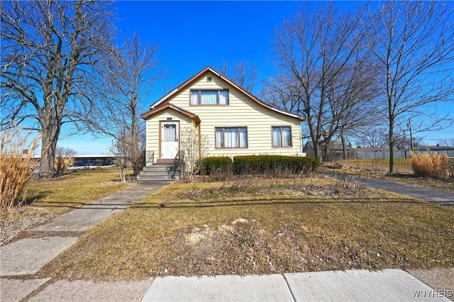 bungalow-style house with entry steps