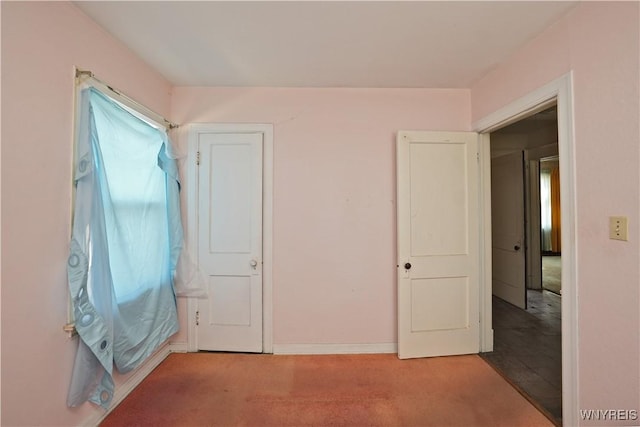 unfurnished bedroom featuring baseboards