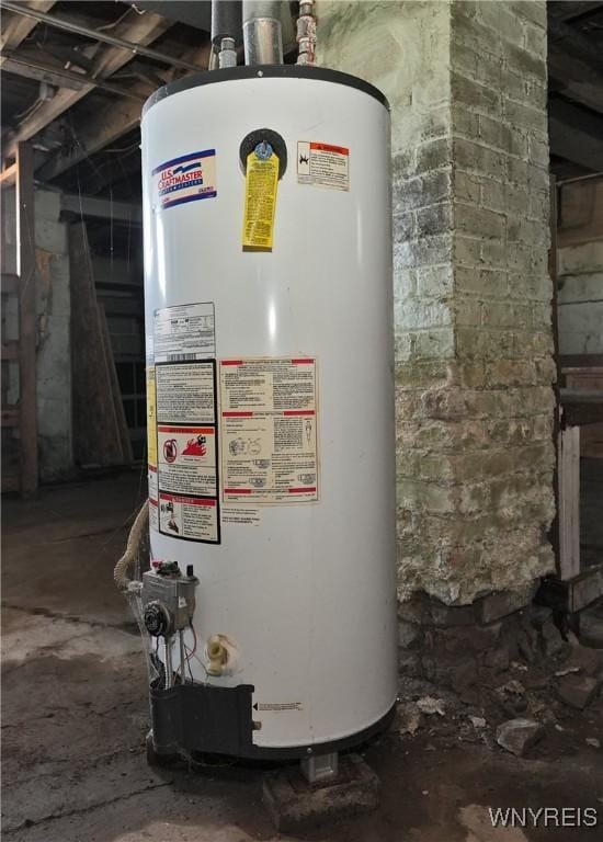 utility room featuring water heater