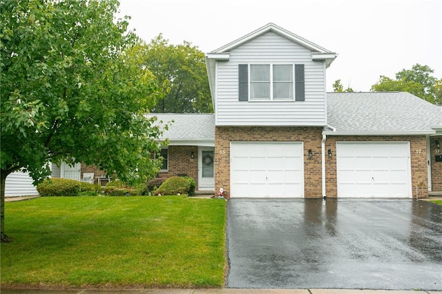 view of front of home with aphalt driveway, brick siding, a front yard, and a shingled roof