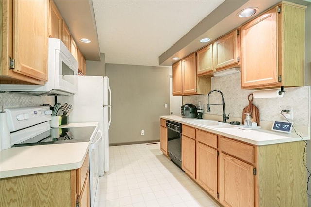 kitchen featuring a sink, white appliances, tasteful backsplash, and light countertops