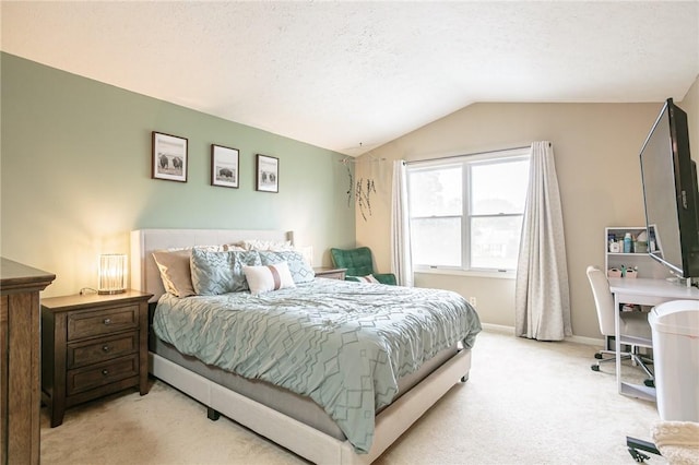 bedroom featuring light carpet, a textured ceiling, baseboards, and vaulted ceiling