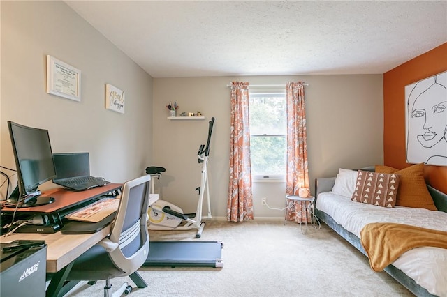 bedroom featuring baseboards, carpet floors, and a textured ceiling