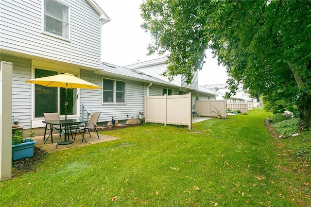 view of yard featuring a patio area and fence