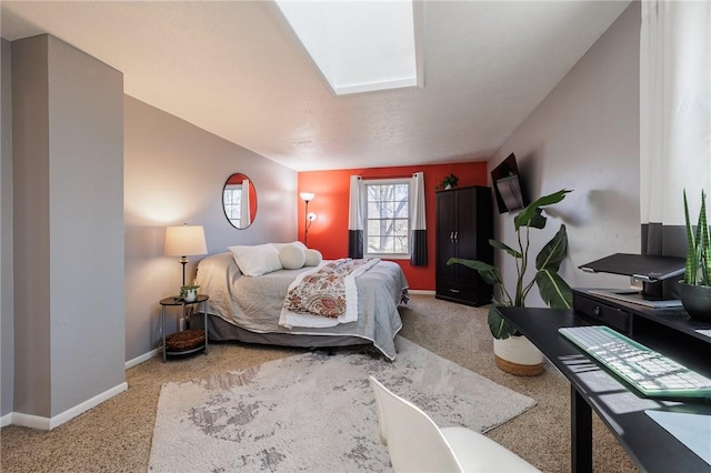 bedroom with light carpet and baseboards