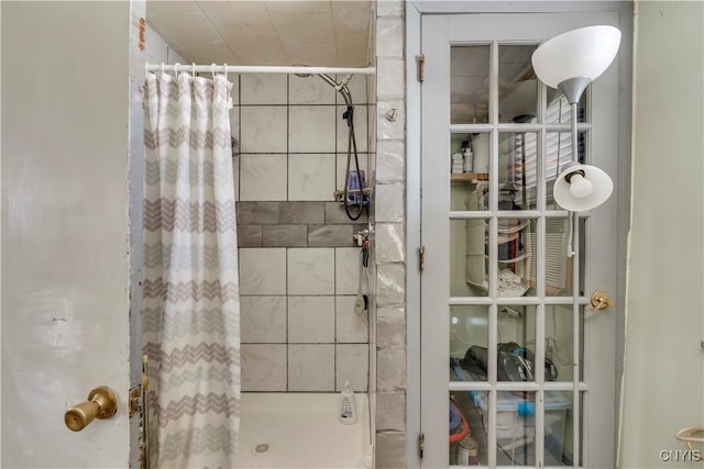 bathroom with a shower stall