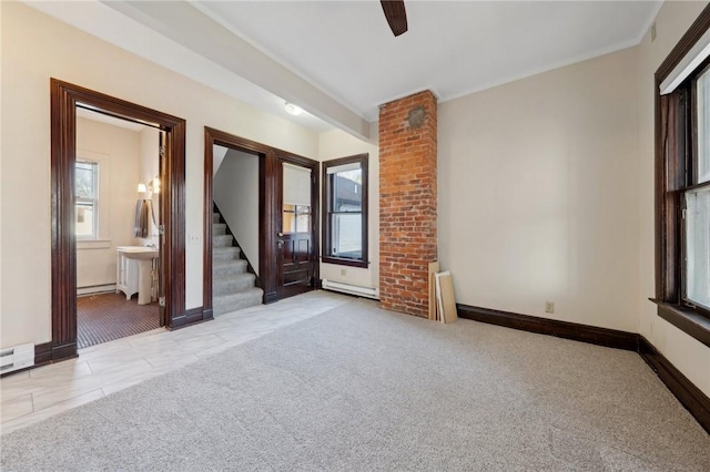 unfurnished room with carpet flooring, stairway, baseboards, and a baseboard radiator