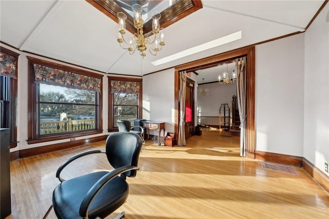 office space with baseboards, an inviting chandelier, wood finished floors, and crown molding