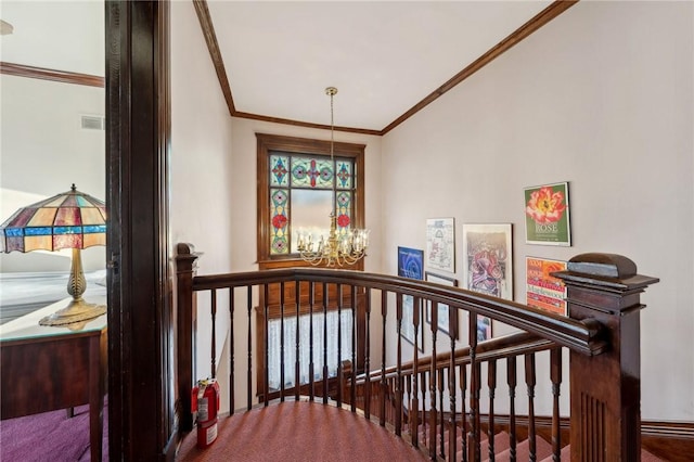 stairway with a chandelier and crown molding