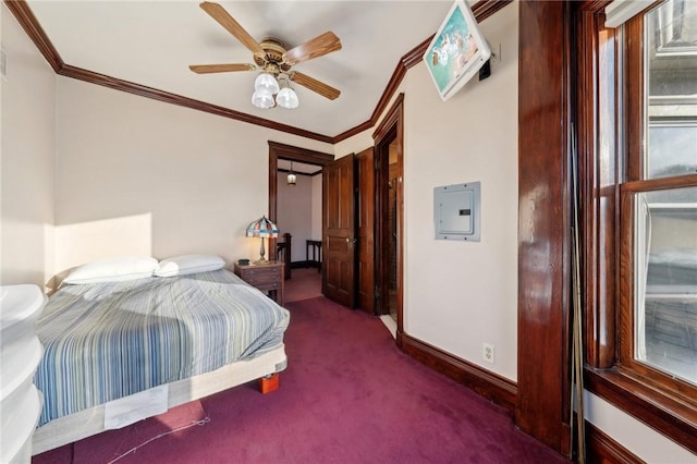 bedroom featuring crown molding, baseboards, carpet floors, electric panel, and a ceiling fan