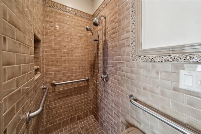 full bath featuring a tile shower