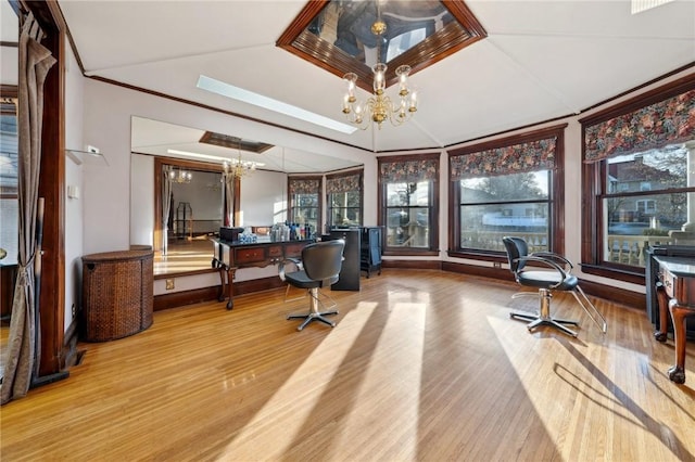 office area with a chandelier, crown molding, and wood finished floors