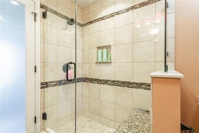 bathroom with a shower stall