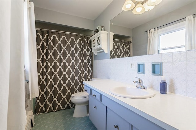 full bathroom featuring vanity, tile walls, toilet, tasteful backsplash, and tile patterned floors