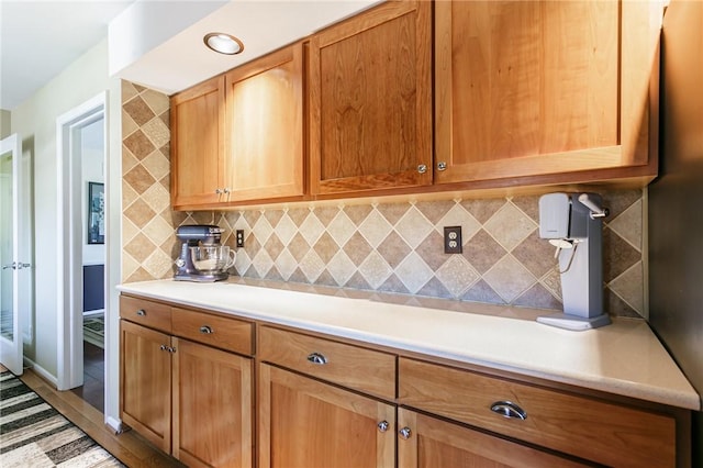 kitchen featuring tasteful backsplash and light countertops