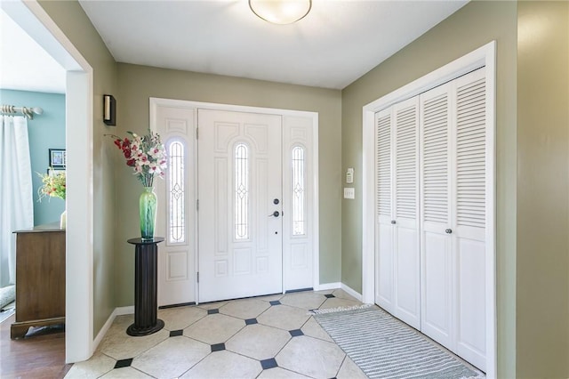 foyer entrance with baseboards