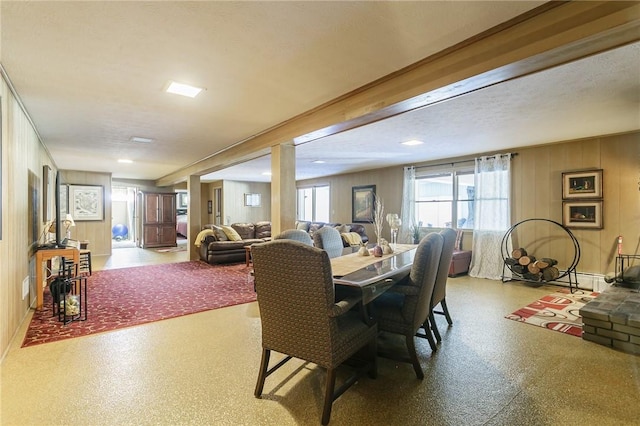 dining room featuring wooden walls