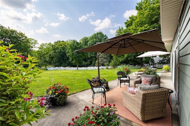 view of patio / terrace featuring an outdoor hangout area and fence