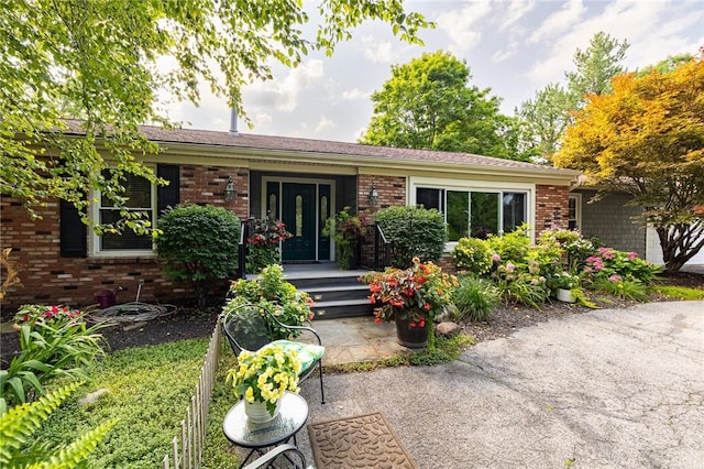 view of front of home featuring brick siding