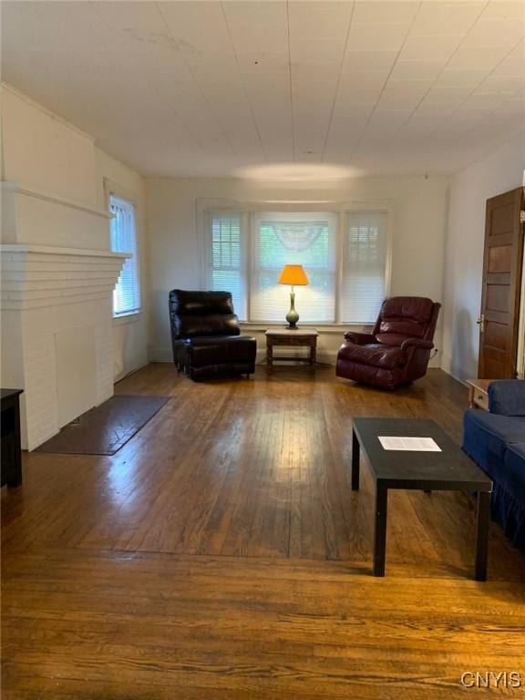 unfurnished living room with hardwood / wood-style flooring