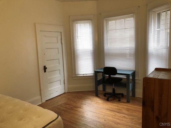 office area featuring wood finished floors and baseboards