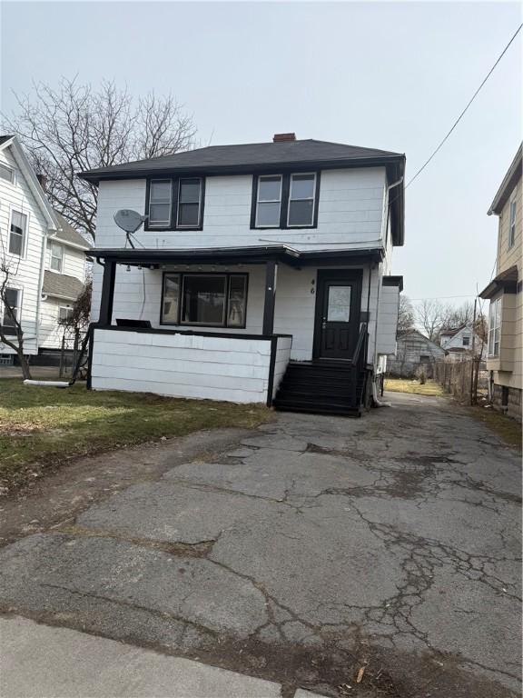 traditional home with aphalt driveway